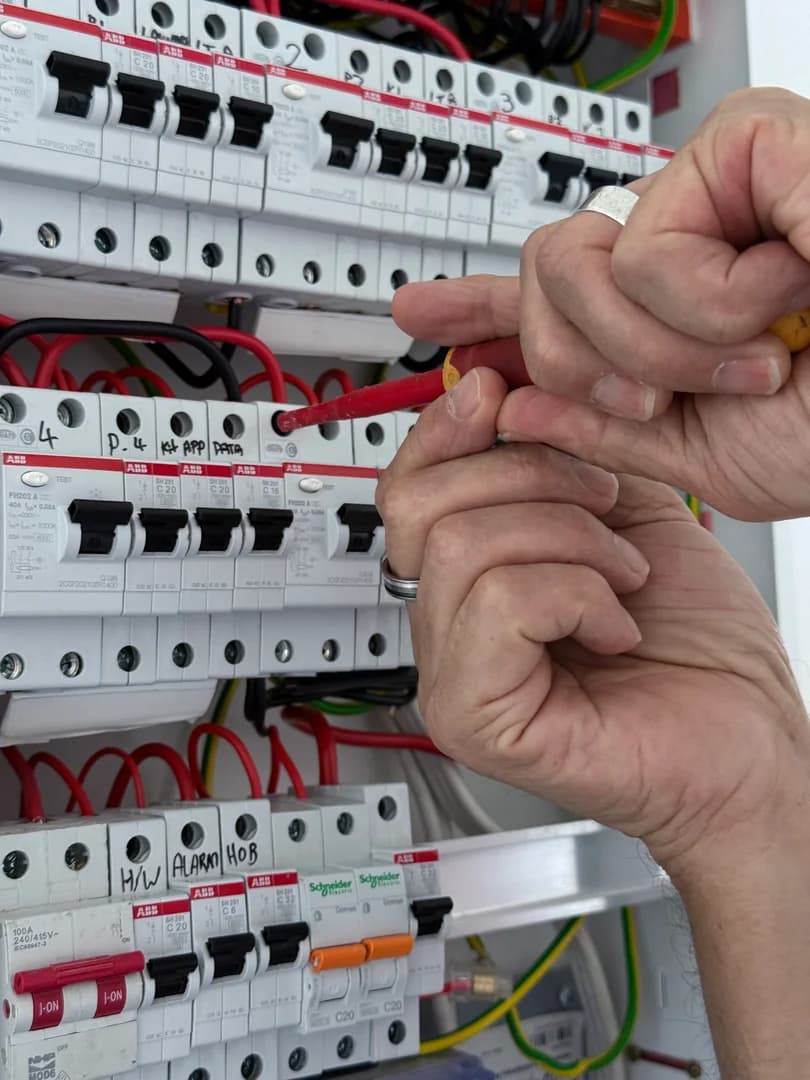 Electrician rewiring an older Auckland home